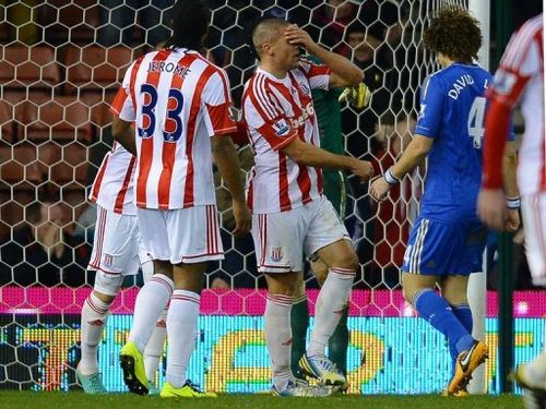 Stoke City's forward Jon Walters (C) reacts after missing a penalty in Stoke-on-Trent on January 12, 2013