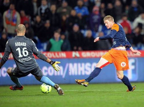 Montpellier's forward Gaetan Charbonnier (R) scores on January 12, 2013 in Montpellier, southern France