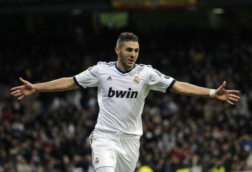 Real Madrid&#039;s Karim Benzema celebrates after scoring at the Santiago Bernabeu Stadium in Madrid on January 15, 2012