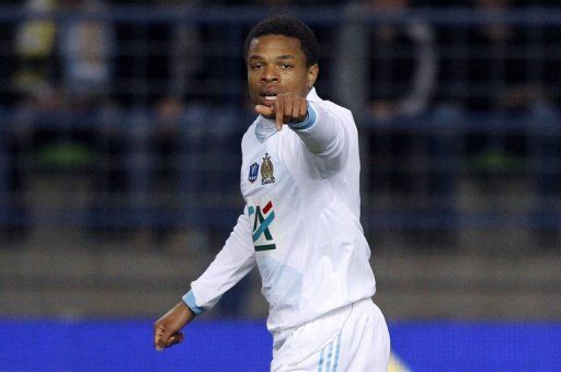 Marseille&#039;s Loic Remy celebrates after scoring a goal on March 20, 2012 at the Michel D&#039;Ornano Stadium in Caen