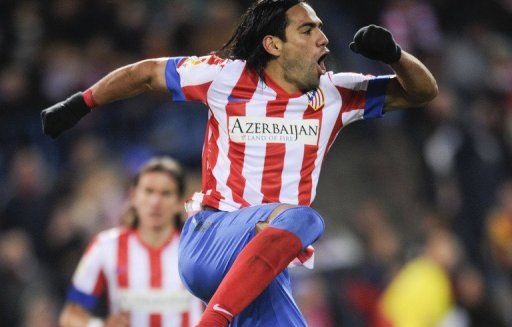 Atletico Madrid&#039;s Radamel Falcao celebrates after scoring at the Vicente Calderon stadium in Madrid on December 9, 2012