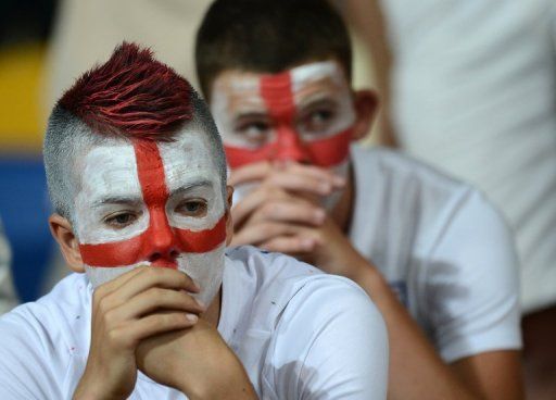 England fans are dejected after seeing their country knocked out by Italy at the European Championships on June 24, 2012