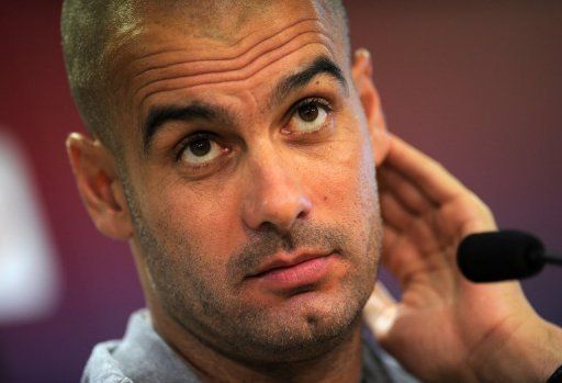 Pep Guardiola gives a press conference at a sports centre near Barcelona on August 13, 2011