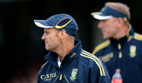 South African head coach Gary Kirsten (L) attends a cricket match in Sydney on November 3, 2012