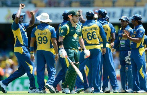Australia&#039;s David Warner is dismissed by Sri Lanka&#039;s Angelo Mathews during their ODI in Brisbane on January 18, 2013