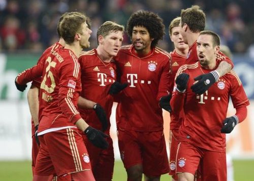 Bayern Munich's players celebrate scoring a goal against Augsburg, on December 8, 2012