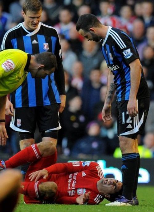 Luis Suarez lies on the ground during Liverpool's FA Cup quarter final against Stoke at Anfield on March 18, 2012