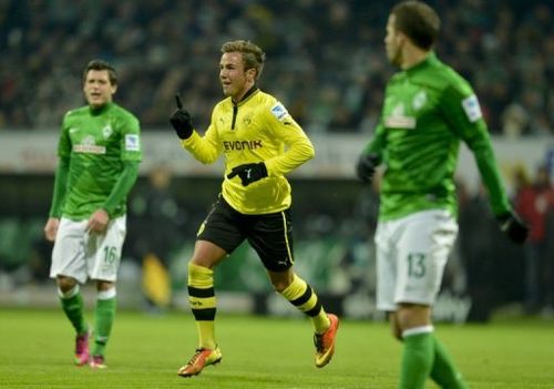 Dortmund's Mario Goetze (C) celebrates scoring in Bremen on January 19, 2013