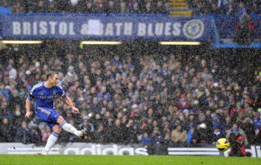 Frank Lampard scores for Chelsea during their match against Arsenal in London on January 20, 2013