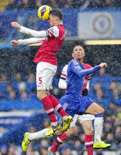 Arsenal&#039;s Thomas Vermaelen and Chelsea&#039;s Fernando Torres during their match in London on January 20, 2013