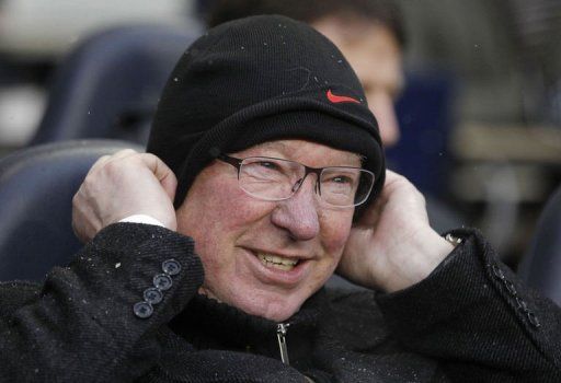 Alex Ferguson awaits kick off at White Hart Lane in London on January 20, 2013