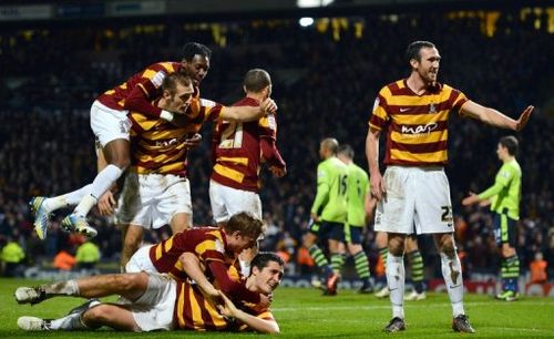 Bradford City's Carl McHugh (bottom) celebrates after scoring the third goal against Aston Villa, January 8, 2013