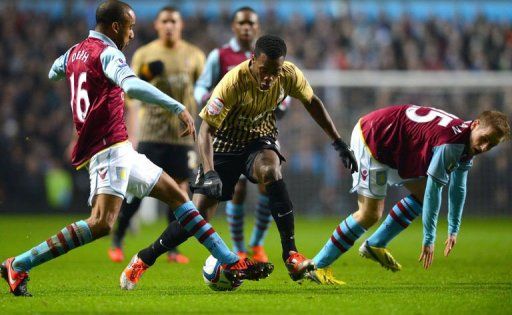 Bradford City&#039;s Zavon Hines (C) and Aston Villa&#039;s Fabian Delph (L) and Barry Bannan at Villa Park on January 22, 2013