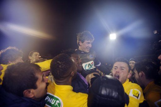 Epinal celebrate after defeating Nantes in the French Cup on January 22, 2013