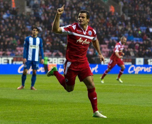 Ryan Nelsen celebrates scoring during the English Premier League clash at Wigan Athletic on December 8, 2012