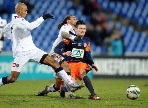 Montpellier&#039;s Remy Cabella (R), Sochaux&#039;s Carlos Roberto da Cruz Junior (L) and Roy Contout (C) on January 23, 2013