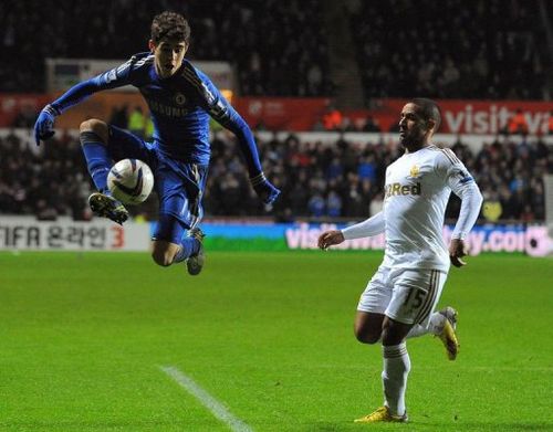 Chelsea's Oscar (L) controls the ball infront of Swansea City's Wayne Routledge (R) in Cardiff on January 23, 2013