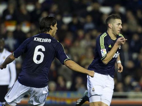 Real Madrid's Karim Benzema (R) and Sami Khedira celebrate in Valencia on January 23, 2013