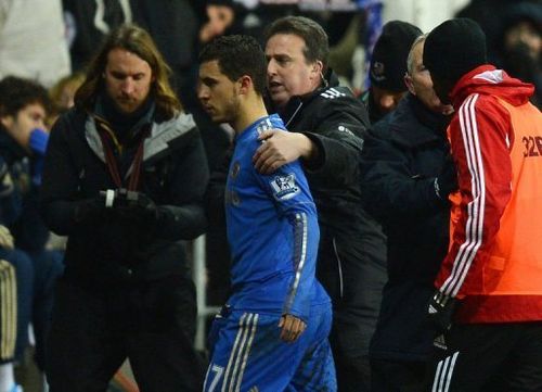 Chelsea's Eden Hazard is escorted off the pitch on January 23, 2013