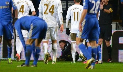 A ball boy lies on the ground after an altercation with Chelsea's Eden Hazard on January 23, 2013