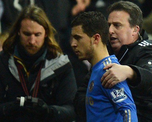 Chelsea&#039;s Eden Hazard is escorted off the pitch on January 23, 2013