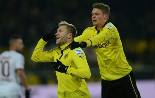 Dortmund&#039;s midfielder Jakub Blaszczykowski (L) and defender Lukasz Piszczek celebrate on January 25, 2013