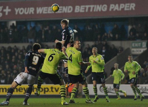 Aston Villa&#039;s Irish striker Andy Keogh (C) heads the ball on January 25, 2013
