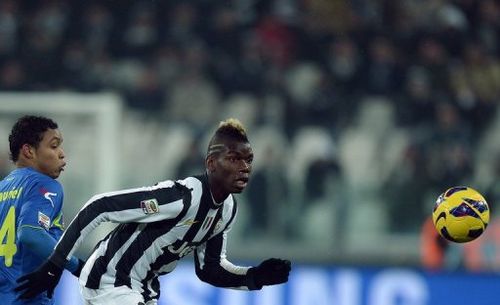 Juventus' Paul Pogba (R) fights for the ball with Udinese's Muriel Fruto Luis Fernando, in Turin, on January 19, 2013