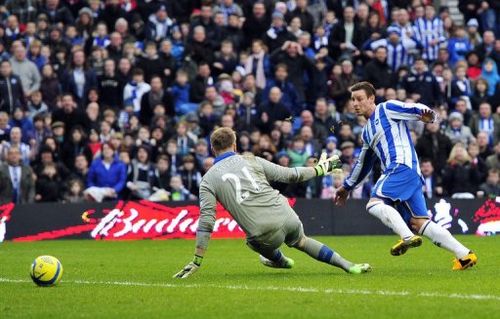 Brighton & Hove Albion's Will Hoskins (R) scores their second goal past Newcastle goalkeeper Rob Elliot, January 5, 2013