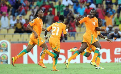 Ivory Coast Midfielder Yaya Toure (R) celebrates after scoring in Rustenburg on January 26, 2013