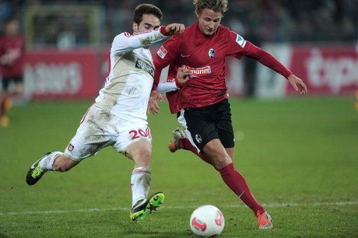 Leverkusen&#039;s defender Daniel Carvajal (R) clashes with Freiburg&#039;s defender Vegar Hedenstad on January 26, 2013