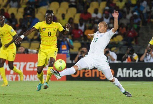 Togo&#039;s midfielder Komlan Amewou (R) clashes with Algeria&#039;s midfielder Adlene Guedioura on January 26, 2013