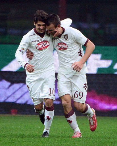 Torino&#039;s Riccardo Meggiorini (R) celebrates after scoring on January 27, 2013 at the San Siro