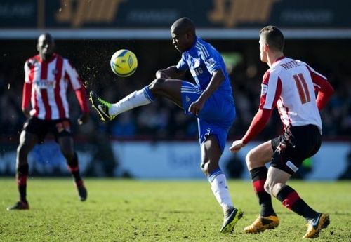 Chelsea's Ramires (C) and Brentford's Marcello Trotta (R) during their FA Cup fourth-round match on January 27, 2013