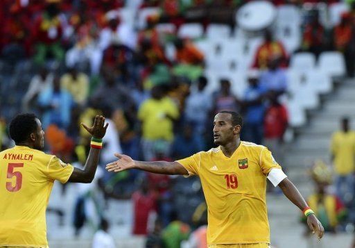 Ethiopia&#039;s Girma Gebrayes (R) celebrates after scoring a goal against Zambia in Nelspruit on January 21, 2013