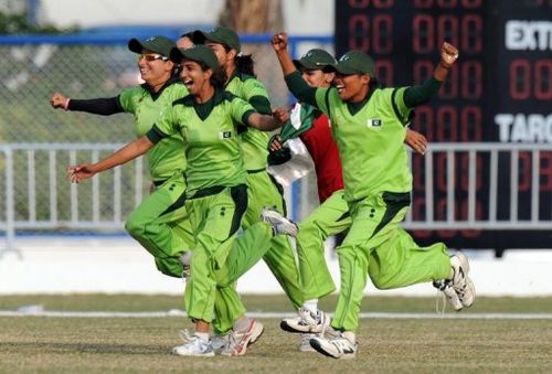 Pakistan invade the pitch to celebrate victory in the women's gold-medal match at the Asian Games on November 19, 2010