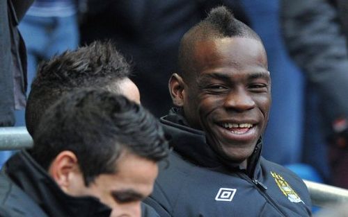 Manchester City striker Mario Balotelli smiles before the FA Cup third-round match at home to Watford on January 5, 2013