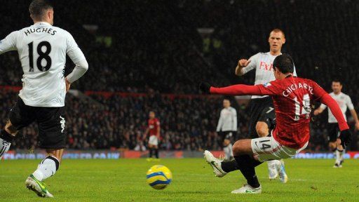 Javier Hernandez scores the fourth goal for Manchester United against Fulham at Old Trafford on January 26, 2013