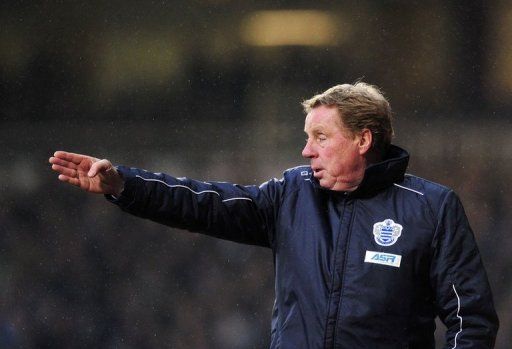 Harry Redknapp gestures to players at the Boleyn Ground, Upton Park, in East London, on January 19, 2013