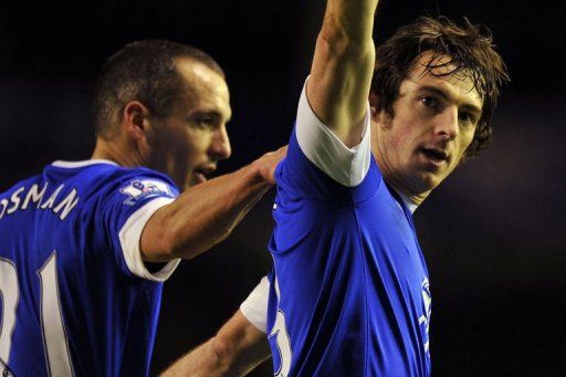 Everton&#039;s Leighton Baines (R) celebrates scoring in Liverpool on January 30, 2013