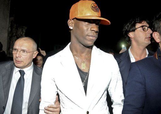 Mario Balotelli (C) pictured utside the 