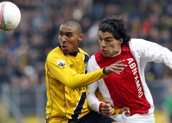 Ajax Amsterdam&#039;s Luis Suarez (R) duels w