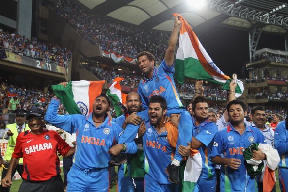 MUMBAI, INDIA - APRIL 02: Sachin Tendulkar of India is lifted by his team mates on a lap of honour after their six wicket victory during the 2011 ICC World Cup Final between India and Sri Lanka at Wankhede Stadium on April 2, 2011 in Mumbai, India.  