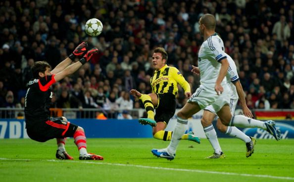 Mario Gotze (2nd R) of Borussia Dortmund scores his sides second goal past goalkeeper Iker Casillas of Real Madrid during the UEFA Champions League group D match between Real Madrid and Borussia Dortmund at Estadio Santiago Bernabeu on November 6, 2012 in Madrid, Spain.