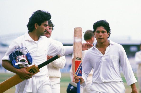 11 Aug 1990:  Sachin Tendulkar of India celebrates hitting 119 runs not out during the Second Test match against England played at Old Trafford, in Manchester, England. 