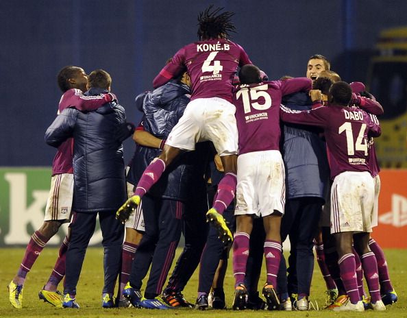 Lyon&#039;s players celebrate after their gro