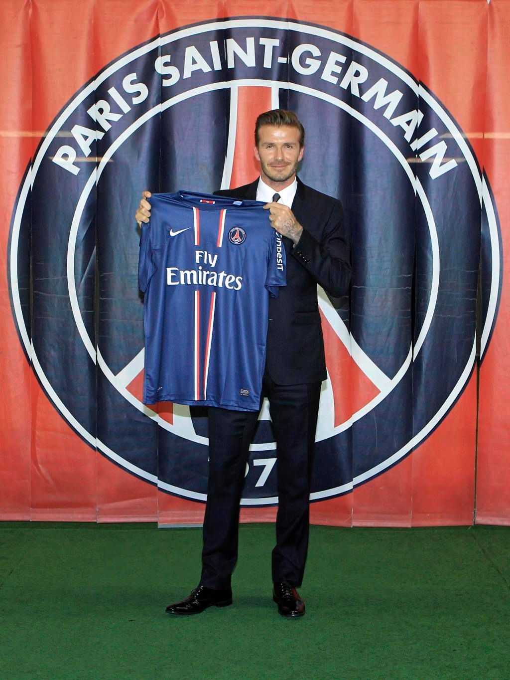Soccer player Beckham present his new jersey after a news conference in Paris