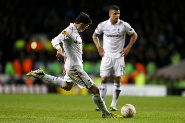 LONDON, ENGLAND - FEBRUARY 14:  Gareth Bale of Spurs scores his team&#039;s match winning second goal from a free kick during the UEFA Europa League round of 32 first leg match between Tottenham Hotspur and Olympique Lyonnais at White Hart Lane