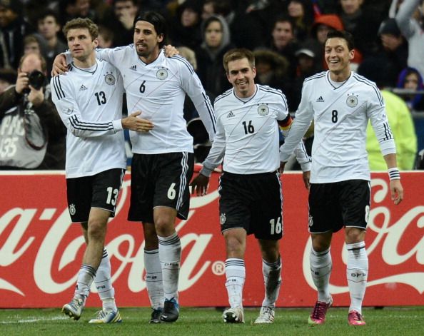 Germany&#039;s midfielder Sami Khedira (C) celebrates with Germany&#039;s midfielder Thomas Mueller after scoring against France 