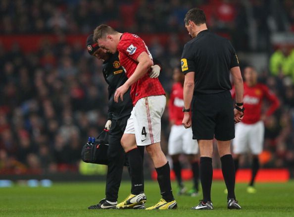 MANCHESTER, ENGLAND - FEBRUARY 18:  Phil Jones of Manchester United is helped off after getting injured during the FA Cup Fifth Round match between Manchester United and Reading